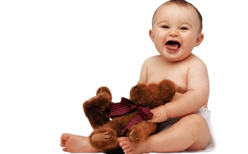 free_wallpaper_of_baby_a_cute_baby_holding_a_teddy_bear